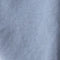 Close-up of a textured blue fabric surface