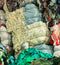 Stack of various colored fabrics with a visible weight tag.